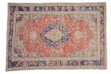 Distressed vintage Oushak carpet: faded brick red, navy roundel medallion, floral bouquets.