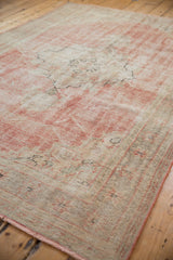 Distressed dusty rose and ivory pile texture with visible foundation and side selvage.
