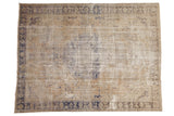 Vintage Distressed Oushak rug with faded beige field, faint cobalt blue floral medallion.