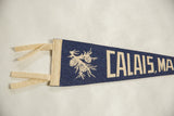 Vintage Calais Maine felt pennant with cream ties and pinecone graphic.