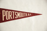 Tapering dark red felt tip of the vintage felt pennant.