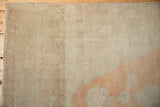 Worn, low-pile texture of a distressed Oushak runner with sandalwood and pale orange abrash.
