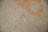 Corner view of the hand-knotted foundation and original side cord selvage on the vintage Oushak rug.
