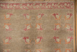 Worn field of Oushak runner features raspberry, ivory, and faded orange blossoms.