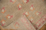 Vintage distressed Oushak rug showing pile wear, faint foundation, raspberry border, and ivory patterns.