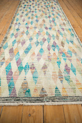 Playful multicolored diamond patterns and distressed texture of the vintage Tulu rug.