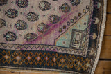 Distressed Oushak runner with mauve, mint, bronze tones, germinating motif, and in-seamed size correction.