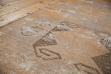 Distressed vintage Oushak runner pile detail, showing visible knot heads, geometric guls, and muted tones.