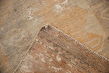 Distressed Vintage Oushak rug pile with gold, saffron, charcoal colors, visible wear, and secured edge.