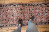 Distressed hand-knotted Sparta runner with flowing floral vines, palmettes in dusty blush and cobalt blue.