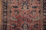 Distressed Sparta rug texture with flowing floral vines in pale cherry red, cobalt blue, and ivory.