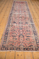 Faded dusty blush field with fluid cobalt blue palmettes on a distressed Sparta runner.