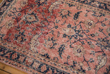 Distressed Sparta runner close-up, highlighting abrash on dusty blush and cobalt blue floral patterns.