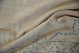 Textured, distressed pile of a vintage Oushak carpet with subtle cobalt blue elements.