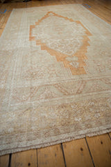 Soft short pile and abrashed ground of vintage Oushak rug in sand and pale rust.