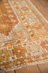 Textured pile of distressed Vintage Oushak rug, showing copper, gold, and faint foundation.
