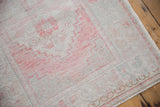 Faded blush pink and ivory pile on a distressed vintage Oushak runner.