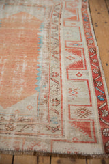 Vintage Distressed Oushak rug with worn terracotta field and ivory, turquoise meandering vine borders.