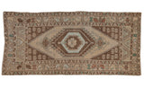 Vintage Oushak runner, distressed beige field with chocolate brown medallions and blue hues.