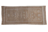 Distressed vintage Oushak runner with faded floral guls, serrated geometric design, pale coffee, 3'7