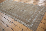 Vintage Distressed Oushak runner with muted pale coffee brown pile and faded floral guls.