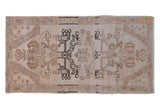 Vintage distressed Oushak rug mat with beige and sand floral vinery and abrashes, 1'8