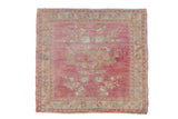 Distressed vintage Oushak square rug with soft pink and ivory floral motifs, 1'11