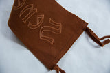 Detailed view of the antique felt pennant's hand-stitched hem and hanging ties.