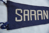 Stitched white felt lettering on deep blue vintage Saranac Lake pennant.