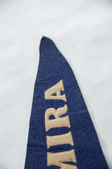 Detail of the prominent beige block letters 'IRA' on blue felt vintage Elmira pennant.