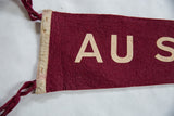 Braided burgundy ties attached to the stitched white felt hoist of the vintage flag.