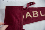 Detail of the burgundy felt ties and stitched hanging sleeve on the vintage flag.