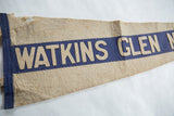 Hand-sewn beige felt Watkins Glen letters on blue, aged wool pennant.