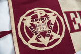 Stitched detail of the vintage felt emblem with 'Mind Spirit Body' and 'John 17:21'.