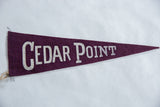 Vintage Cedar Point felt pennant, white lettering on deep purple textured fabric.
