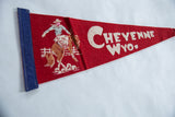 Vintage felt pennant corner with blue trim and partial cowboy bronco graphic.