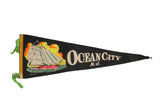 Vintage Ocean City NJ felt pennant with colorful sailboat graphic and 'OCEAN CITY N.J.' text, 26x9 inches.