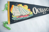 Vintage Ocean City NJ felt pennant with yellow binding strip and green ties.