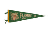 Vintage Farmington Maine felt pennant in green with a buck graphic and yellow side binding.