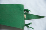 White stitching and green felt ties on the back of the vintage Farmington pennant.