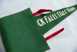 CK FALLS STATE PARK lettering on vintage green felt pennant with red ties.