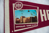 Maroon felt Vintage Hershey PA pennant with circular logo, building photo, and Kiss street lamp.