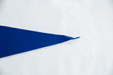 Pointed tip of vintage blue felt pennant with minor fraying.