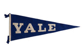 Vintage Yale felt pennant flag with bold white lettering on deep blue felt, 29x11.