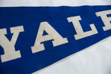 Vintage Yale Felt Flag close-up showing blue felt and white 'ALE' lettering with subtle patina.
