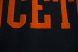 Orange felt letters CET with stitched borders on black vintage Princeton banner.