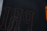 Black felt Princeton banner with orange embroidered outline lettering.