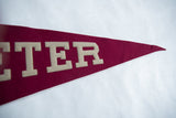 Vintage Exeter felt pennant with textured burgundy fabric and white 'ETER' letters.