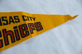 Vintage Kansas City Chiefs felt pennant, red and black 'Chiefs' lettering, visible creasing.