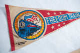 Vintage felt Freedom Train pennant graphic with blue train, US flag map, and 1976 text.